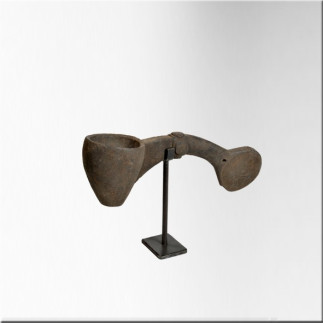 Small wooden milk ladle on iron base
