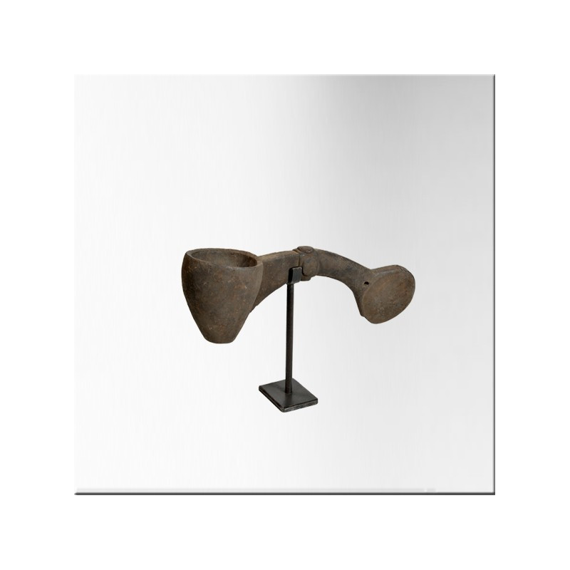 Small wooden milk ladle on iron base