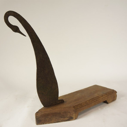 Iron and wood coconut shell cutter
