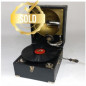 Portable phonograph in its rectangular case
