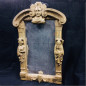 Rectangular wooden mirror featuring carved mascaron decorations 18th century