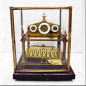 Brass clock with a ball pendulum Early 20th century