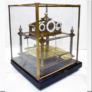 Horloge à billes cadran en laiton