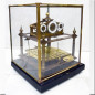 Brass clock with a ball pendulum Early 20th century