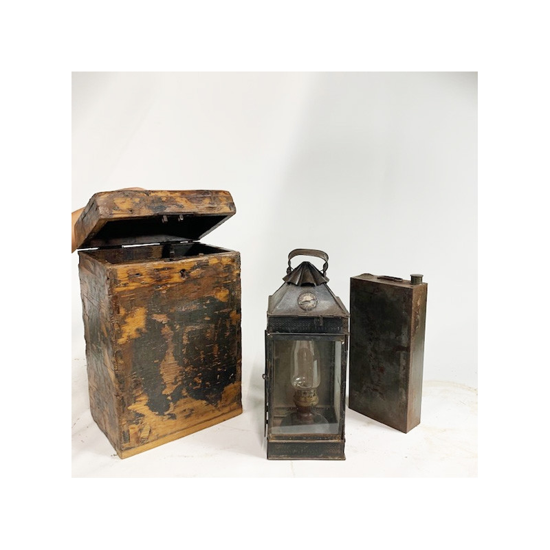 Petroleum sheet and glass lamp in a wooden box