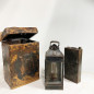 Petroleum sheet and glass lamp in a wooden box