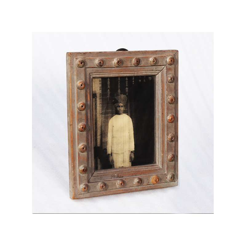 Wooden frame and portrait of a young Indian