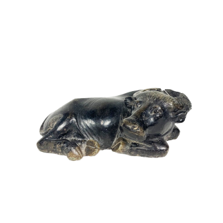 Black marble lying down cow early 19th century