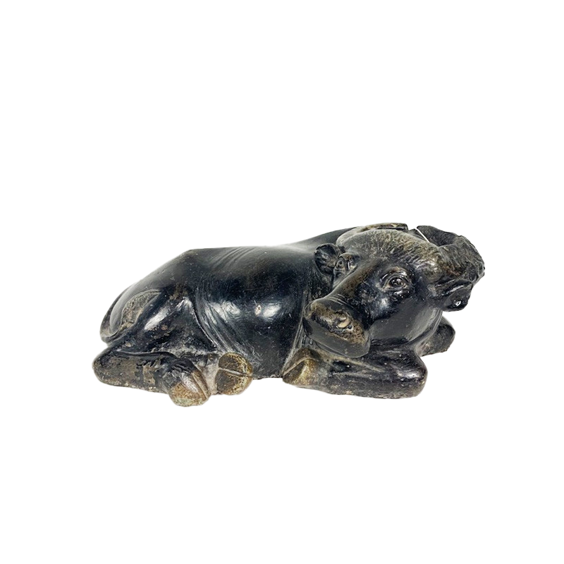 Black marble lying down cow early 19th century