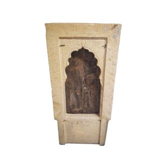 Small rectangular window in carved stone with pointed arch 18th century