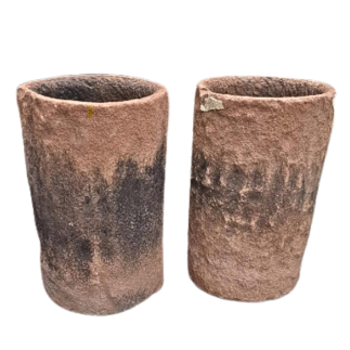 Pair of cylindrical monoblock vases in carved pink sandstone 19th century