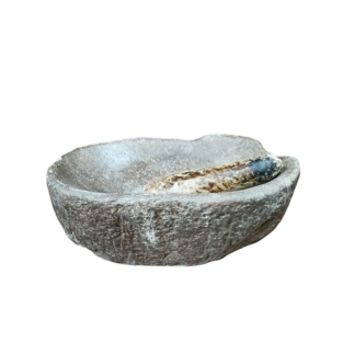 Oval-shaped mortar in dark gray stone, accompanied by its white marble pestle.  17th Century.