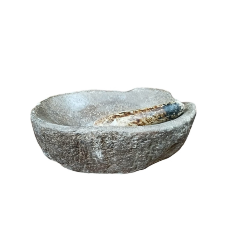 Oval-shaped mortar in dark gray stone, accompanied by its white marble pestle.  17th Century.