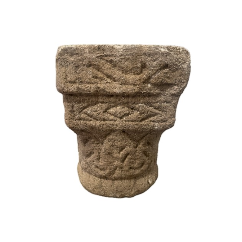 Carved stone capital, decorated on all sides. 12th Century.