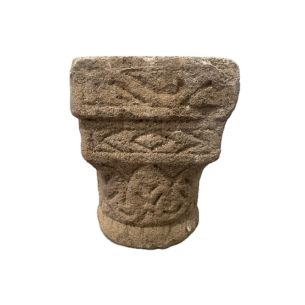 Carved stone capital, decorated on all sides. 12th Century.