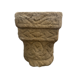 Carved stone capital, decorated on all sides. 12th Century.