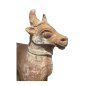 An impressive hand-sculpted terracotta figure of a stylised bull India late 19th century